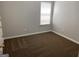 Bedroom with a neutral color scheme, wall-to-wall carpet and a window at 165 Lakeside Pt, Covington, GA 30016