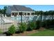 Community pool with lounge chairs and a fenced perimeter providing a relaxing neighborhood amenity at 165 Lakeside Pt, Covington, GA 30016
