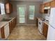 Functional kitchen featuring white appliances and ample counter space at 165 Lakeside Pt, Covington, GA 30016