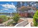 Scenic lake view showcasing a gazebo, a brick building, and lush landscaping at 165 Lakeside Pt, Covington, GA 30016