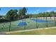 Community tennis and basketball courts with pristine green and blue surfaces at 165 Lakeside Pt, Covington, GA 30016