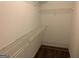 Walk-in closet featuring shelving and carpeting at 165 Lakeside Pt, Covington, GA 30016