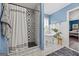 Chic bathroom featuring a tiled shower and a freestanding soaking tub with stylish fixtures at 301 Bradford Ct, Auburn, GA 30011