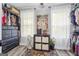 Walk in closet with ample shelving and storage space near a window at 301 Bradford Ct, Auburn, GA 30011