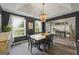 Elegant dining room featuring a modern chandelier, natural light, and stylish gray walls at 301 Bradford Ct, Auburn, GA 30011