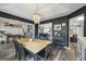 Open dining room with modern chandelier, seamlessly connects to other living spaces in the home at 301 Bradford Ct, Auburn, GA 30011