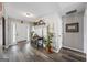 Inviting foyer with a decorative shelf with plants, desk, and plenty of natural light at 301 Bradford Ct, Auburn, GA 30011