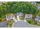 Residential area featuring well-manicured lawns, mature trees, and neatly arranged homes in a cul-de-sac at 8 Saint Charles Ave, Sharpsburg, GA 30277