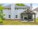 Charming backyard with a covered outdoor seating area, complete with a grill and comfortable furniture at 8 Saint Charles Ave, Sharpsburg, GA 30277