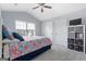 Cozy bedroom with natural light, vaulted ceiling, and neutral color palette at 8 Saint Charles Ave, Sharpsburg, GA 30277