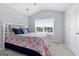 Bright bedroom with natural light, vaulted ceiling, and neutral color palette at 8 Saint Charles Ave, Sharpsburg, GA 30277