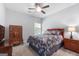 Cozy bedroom with a comfortable bed, soft lighting, and charming wooden furnishings for a peaceful retreat at 8 Saint Charles Ave, Sharpsburg, GA 30277