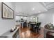 Open-concept dining area with hardwood floors, seamlessly connects to the kitchen, perfect for entertaining at 8 Saint Charles Ave, Sharpsburg, GA 30277