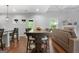 Dining area features a spacious table, hardwood floors, and lots of natural light at 8 Saint Charles Ave, Sharpsburg, GA 30277