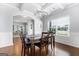 Elegant dining room with coffered ceilings, hardwood floors, and a window with natural light at 8 Saint Charles Ave, Sharpsburg, GA 30277