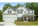 Charming two-story home with a well-manicured lawn, two car garage and tasteful landscaping at 8 Saint Charles Ave, Sharpsburg, GA 30277