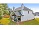Spacious two-story home with a well-maintained lawn and a cozy, covered patio area for outdoor enjoyment at 8 Saint Charles Ave, Sharpsburg, GA 30277