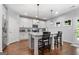 Modern kitchen features granite countertops, stainless steel appliances, and an island with seating at 8 Saint Charles Ave, Sharpsburg, GA 30277