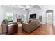 Spacious living room boasting a fireplace, hardwood floors, and neutral color scheme at 8 Saint Charles Ave, Sharpsburg, GA 30277