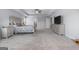 Spacious main bedroom with neutral walls, a ceiling fan and large windows for natural light and fresh air at 8 Saint Charles Ave, Sharpsburg, GA 30277