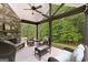 Inviting outdoor space with stone fireplace, comfortable seating, and wooded views at 8 Saint Charles Ave, Sharpsburg, GA 30277