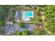 Aerial view of a community pool area with ample seating, a playground, and convenient parking at 8 Saint Charles Ave, Sharpsburg, GA 30277