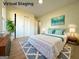 Virtual staging showcases a stylish bedroom with a comfortable bed and tasteful decor, highlighting the room's potential at 6268 Mount Zion Blvd, Morrow, GA 30260