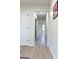 Bright hallway with hardwood floors and multiple doors at 6268 Mount Zion Blvd, Morrow, GA 30260