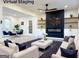 Virtual staging featuring modern fireplace, dining area, and living room at 6268 Mount Zion Blvd, Morrow, GA 30260