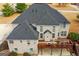 Aerial view of the home's exterior with a deck and outdoor grill at 1202 Persimmon Way, Mcdonough, GA 30252