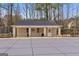 Brick pool house with a covered area next to an in-ground pool covered for the winter at 1202 Persimmon Way, Mcdonough, GA 30252