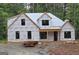 New construction home featuring modern windows and a covered front entry at 2039 Fischer Rd, Sharpsburg, GA 30277