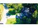 Birds eye view of the home situated on a lot surrounded by mature trees, providing shade and privacy at 8846 Wesley Pl, Jonesboro, GA 30238