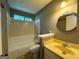 Bathroom featuring a shower-tub combination and a sink with a beige countertop at 8846 Wesley Pl, Jonesboro, GA 30238