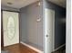 The entryway features a decorative glass front door and hardwood flooring at 8846 Wesley Pl, Jonesboro, GA 30238