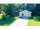 Cozy one-story home featuring a quaint front yard, covered porch, and inviting curb appeal at 8846 Wesley Pl, Jonesboro, GA 30238
