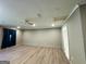 Light-filled living room with wood-look floors, ceiling fan, and potential for customization at 8846 Wesley Pl, Jonesboro, GA 30238