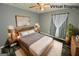 Virtual staging shows the main bedroom with a white shag rug, dark floors, and lamps on the nightstands at 8846 Wesley Pl, Jonesboro, GA 30238