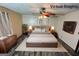 Virtual staging shows a bedroom with dark floors and a large bed at 8846 Wesley Pl, Jonesboro, GA 30238