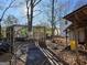 Backyard featuring a partial wood pergola, a concrete pad, and a yellow garbage can at 953 South Ave, Forest Park, GA 30297