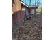 Exterior view showing brick detail, AC unit, gas meter, and foliage-covered yard at 953 South Ave, Forest Park, GA 30297