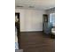 Open living room with dark wood floors and neutral walls, offering ample space for furnishings at 953 South Ave, Forest Park, GA 30297