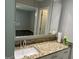 Bathroom vanity with granite countertop, sink, and mirrored medicine cabinet at 6884 Shangrila Way, Riverdale, GA 30296