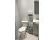 Neat half-bathroom featuring a toilet, sink with vanity, and essential fixtures for guest convenience at 6884 Shangrila Way, Riverdale, GA 30296