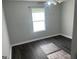 Bedroom with ceiling fan, natural light from window and hardwood flooring at 6884 Shangrila Way, Riverdale, GA 30296