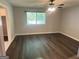 Bedroom with natural light from window and hardwood flooring at 6884 Shangrila Way, Riverdale, GA 30296