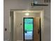 Entryway features a view to the backyard, fan, and modern light fixture at 6884 Shangrila Way, Riverdale, GA 30296