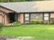 Home with a well-manicured lawn, stone accent, and neatly trimmed hedges at 6884 Shangrila Way, Riverdale, GA 30296