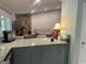Open kitchen bar overlooks the cozy living room with access to the back deck at 6884 Shangrila Way, Riverdale, GA 30296