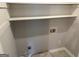 Bright, neutral-toned laundry room offering ample storage and washer hookups at 6884 Shangrila Way, Riverdale, GA 30296